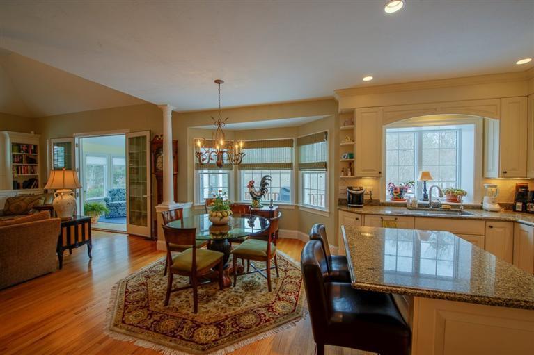 76 Greensward Road Mashpee, MA 02649 - Photo 6 of 24 a living room with fireplace furniture and a wooden floor