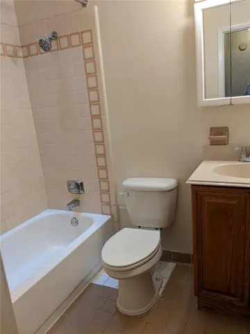 a white toilet sitting next to a bathroom sink
