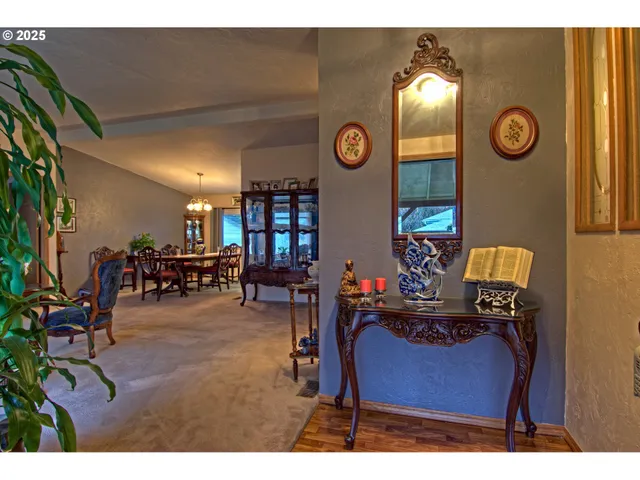 a view of a livingroom with furniture and a chair