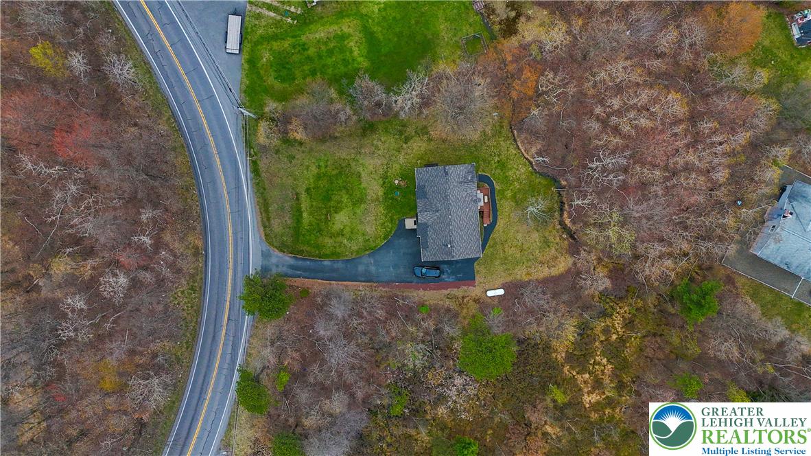 2742 Long Pond Road Long Pond, PA 18334 - Photo 4 of 57 An aerial perspective reveals a private residence nestled amongst natural surroundings with convenient road access.