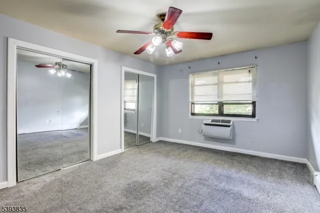 wooden floor and an empty room with a ceiling fan