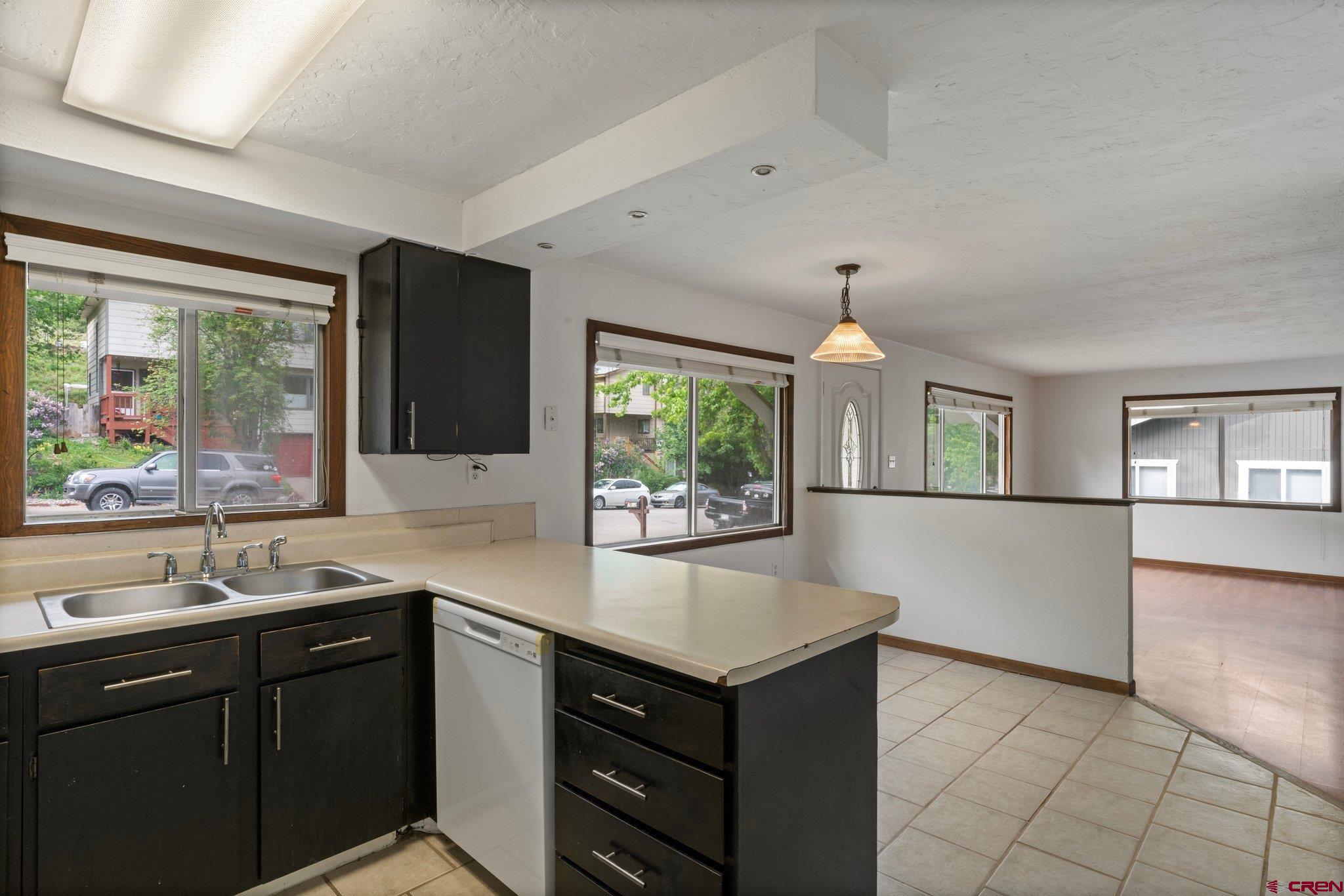 2913 Richard Drive Durango, CO 81301 - Photo 15 of 35 a kitchen with a sink and large windows