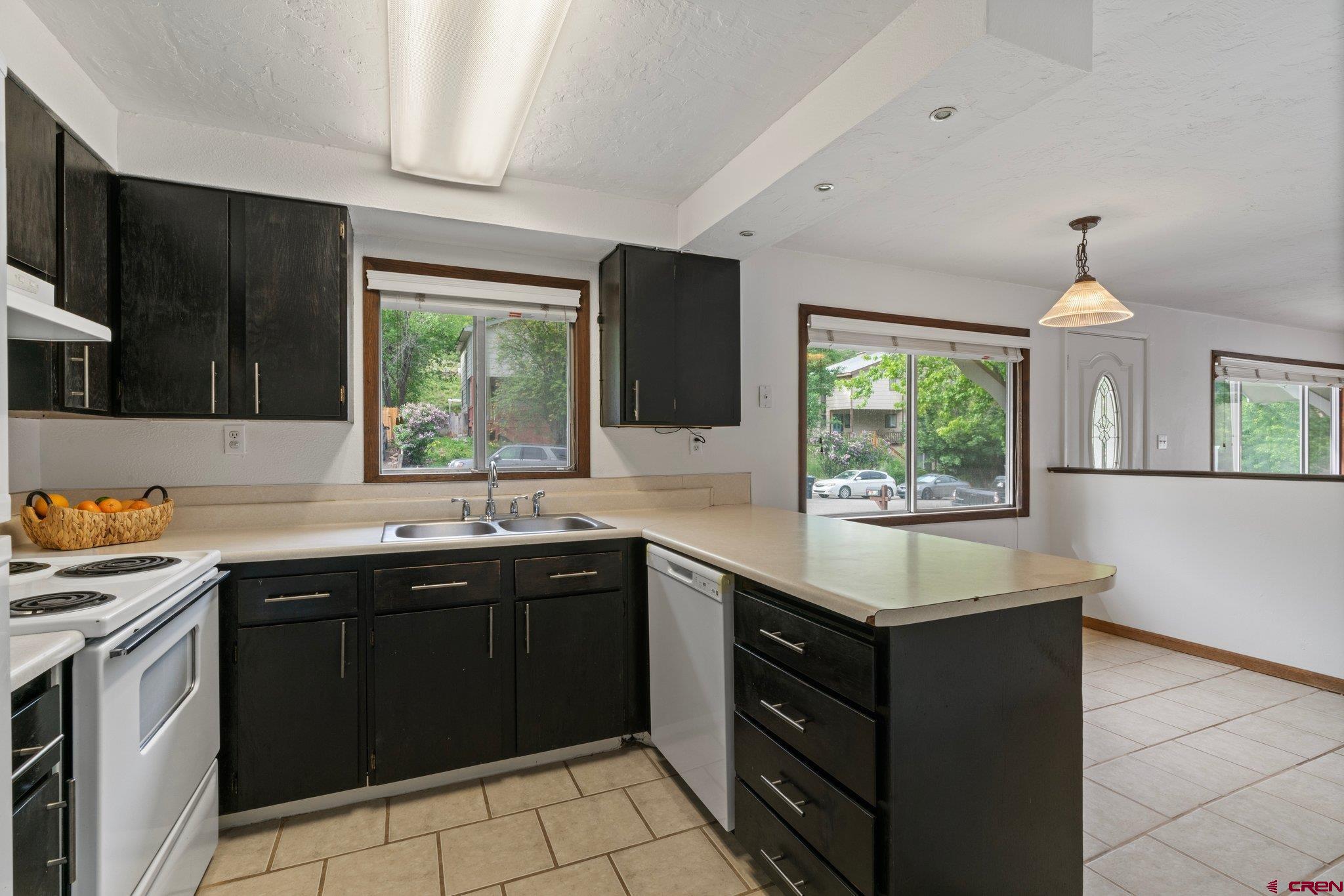 2913 Richard Drive Durango, CO 81301 - Photo 16 of 35 a kitchen with a sink stove and microwave