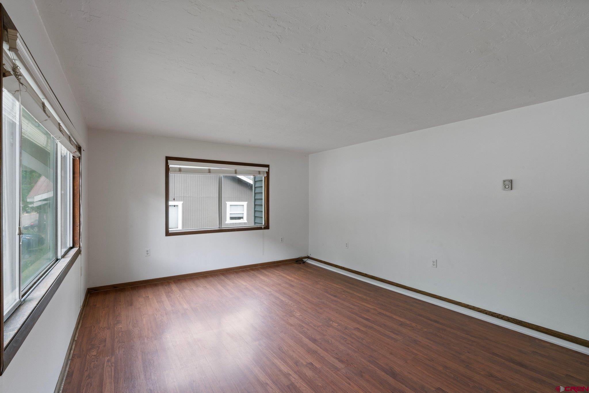 2913 Richard Drive Durango, CO 81301 - Photo 2 of 35 a view of an empty room with wooden floor and a window