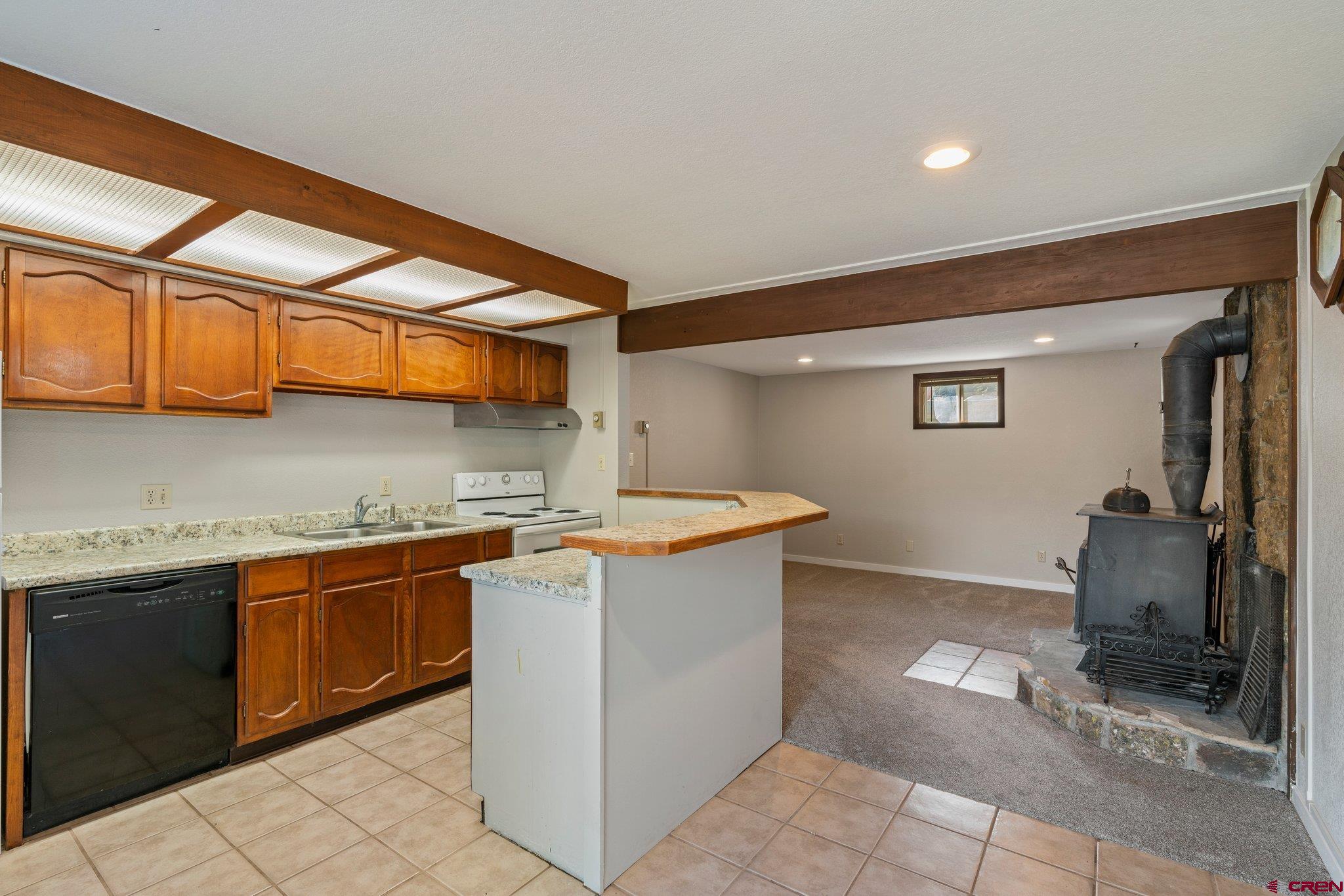 2913 Richard Drive Durango, CO 81301 - Photo 24 of 35 a kitchen with stainless steel appliances granite countertop a sink and cabinets