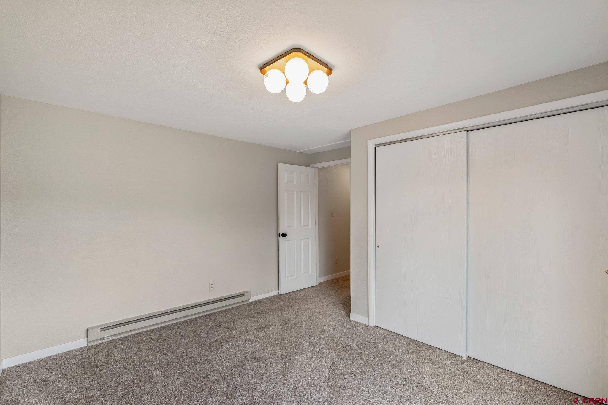 2913 Richard Drive Durango, CO 81301 - Photo 35 of 35 a view of an empty room with a window and a chandelier fan