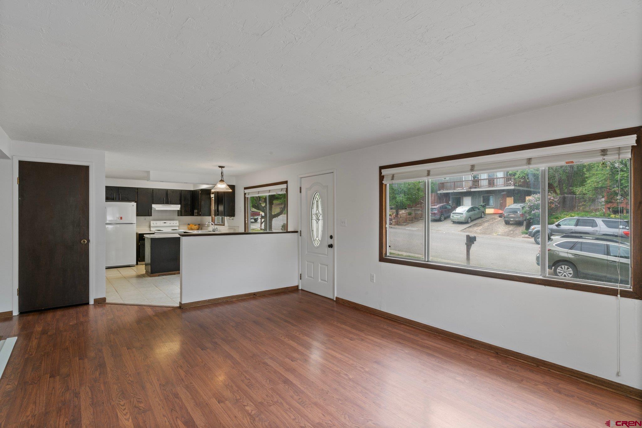 2913 Richard Drive Durango, CO 81301 - Photo 5 of 35 a view of a living room hardwood floor and a large window