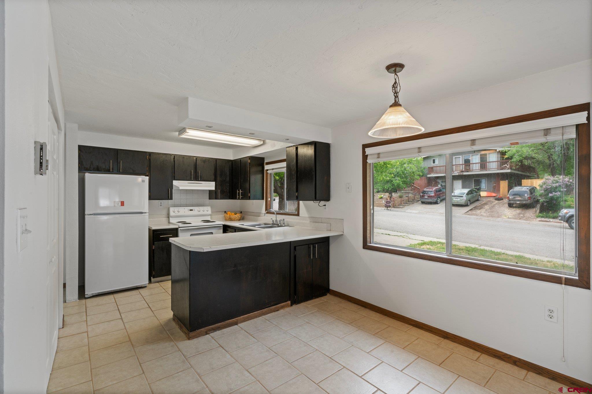 2913 Richard Drive Durango, CO 81301 - Photo 7 of 35 a view kitchen with a stove and a sink
