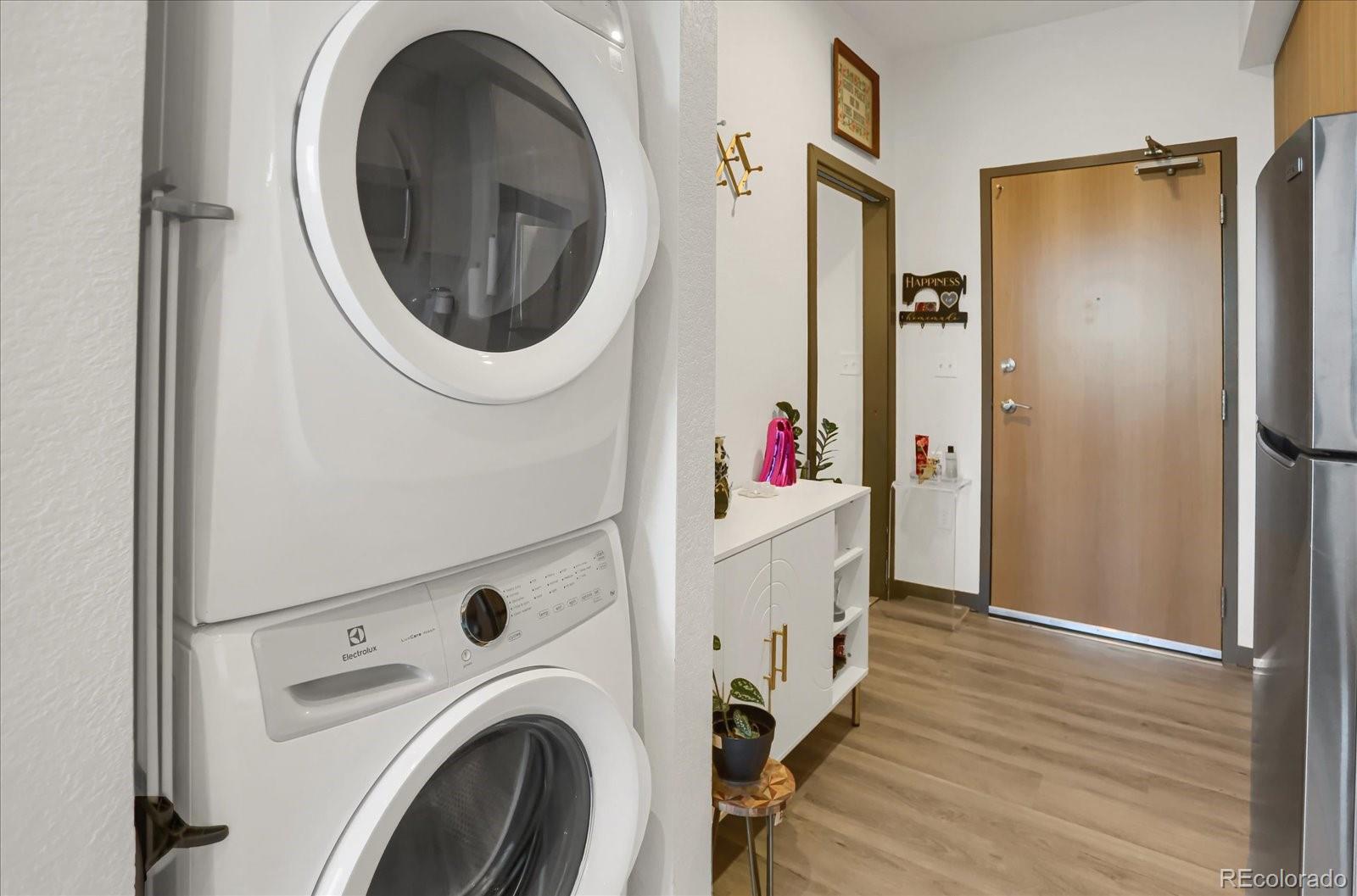 603 Inca Street, Unit 423 Denver, CO 80204 - Photo 11 of 20 a view of a hallway with washer and dryer