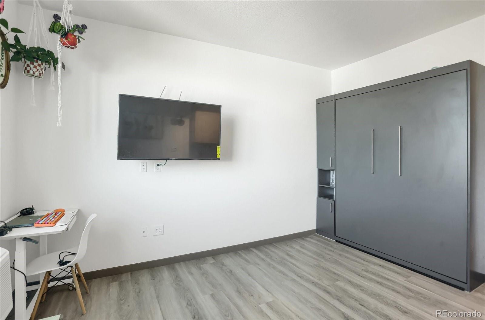 603 Inca Street, Unit 423 Denver, CO 80204 - Photo 7 of 20 a view of a livingroom with furniture and wooden floor