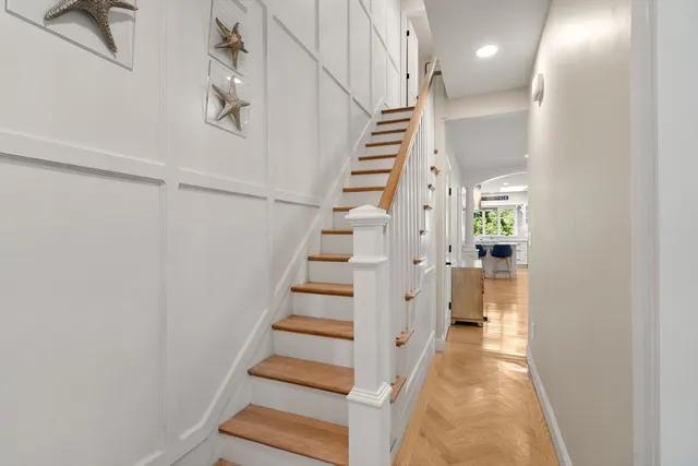 a view of entryway with wooden floor