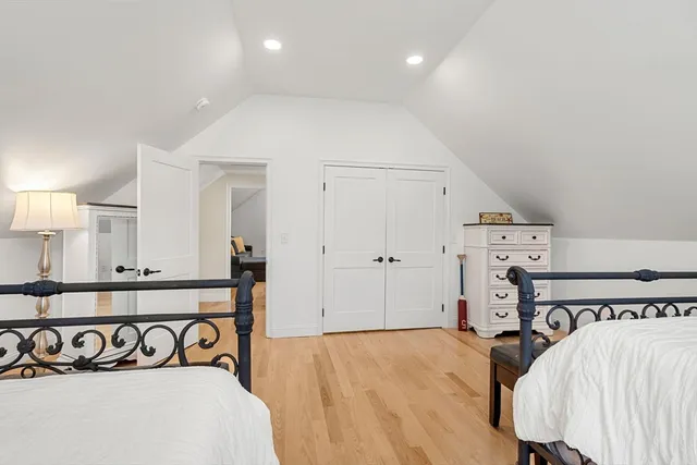 a view of a bedroom with bed and a chandelier