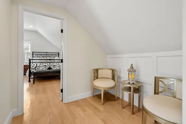 a hotel room with a bed and a chair