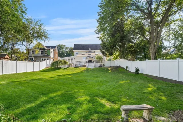 a view of a chair and table in the yard