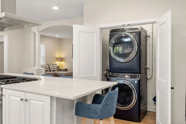 a utility room with sink dryer and washer