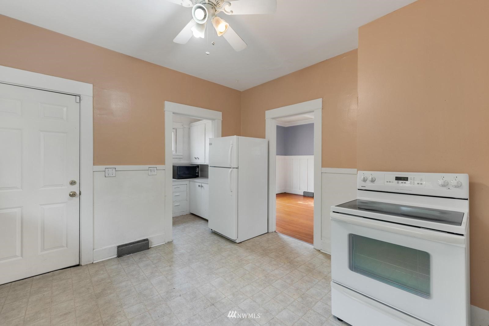 4852 South Orcas Street Seattle, WA 98118 - Photo 11 of 20 a kitchen with a stove and a refrigerator