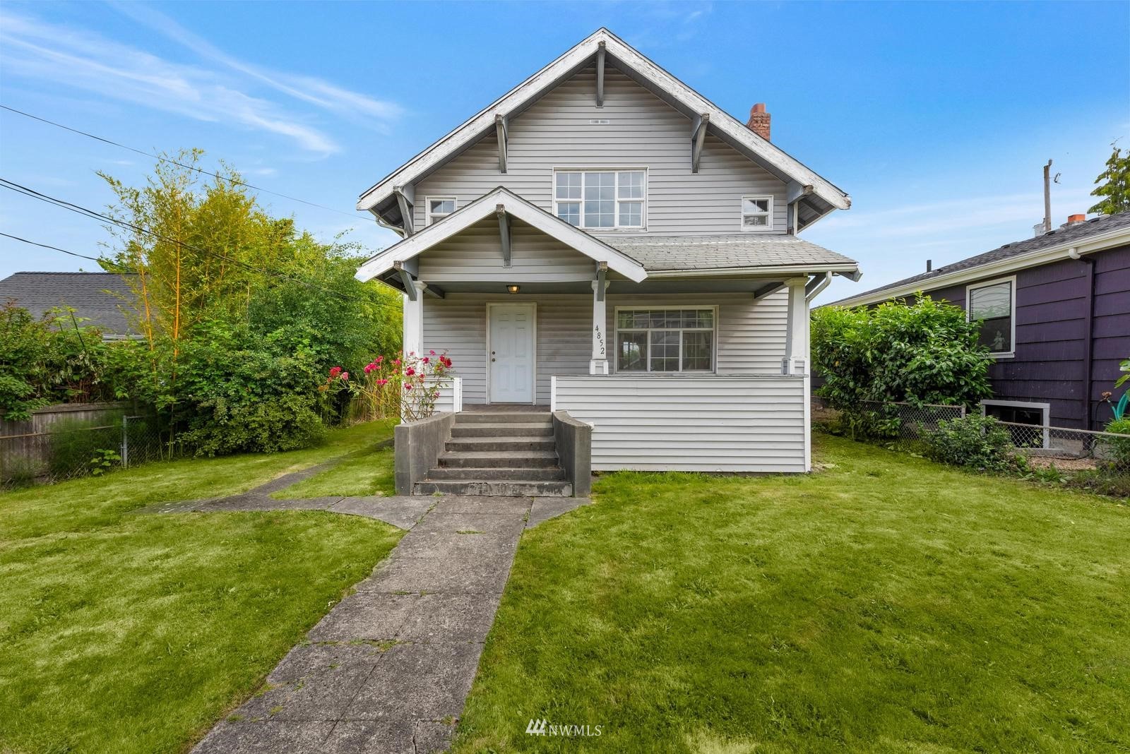 4852 South Orcas Street Seattle, WA 98118 - Photo 19 of 20 a front view of a house with garden