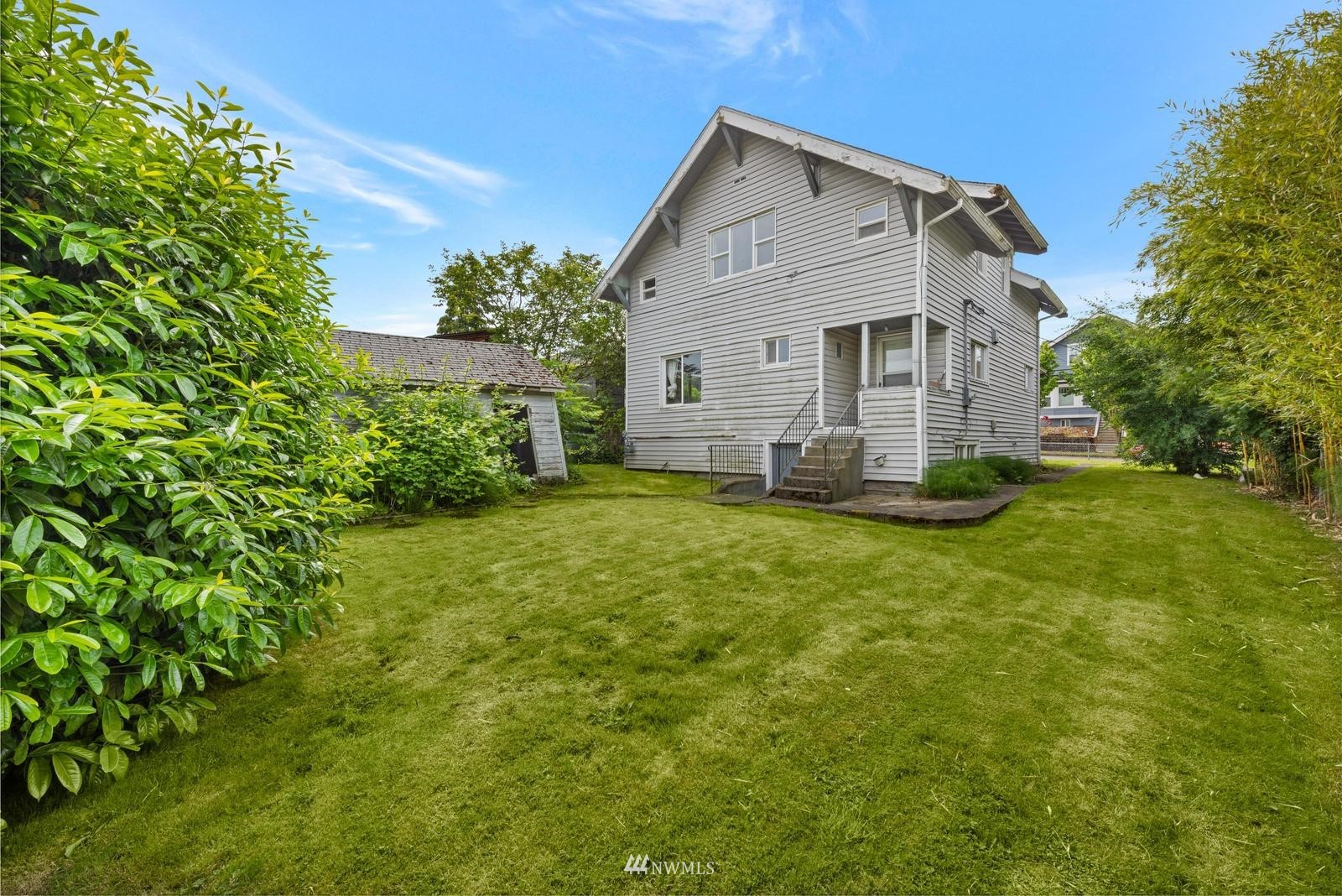 4852 South Orcas Street Seattle, WA 98118 - Photo 20 of 20 a view of a house with a yard