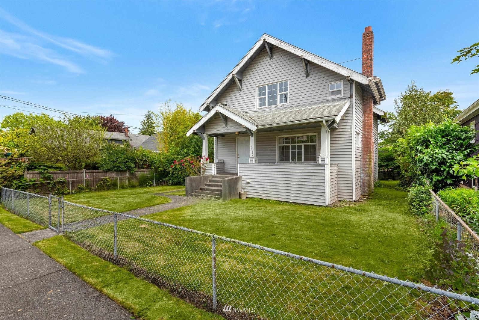 4852 South Orcas Street Seattle, WA 98118 - Photo 2 of 20 a view of a house with backyard