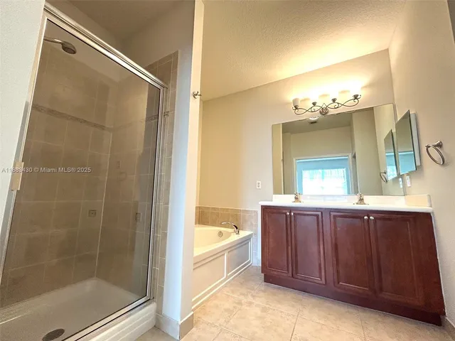 a bathroom with a bathtub and a sink