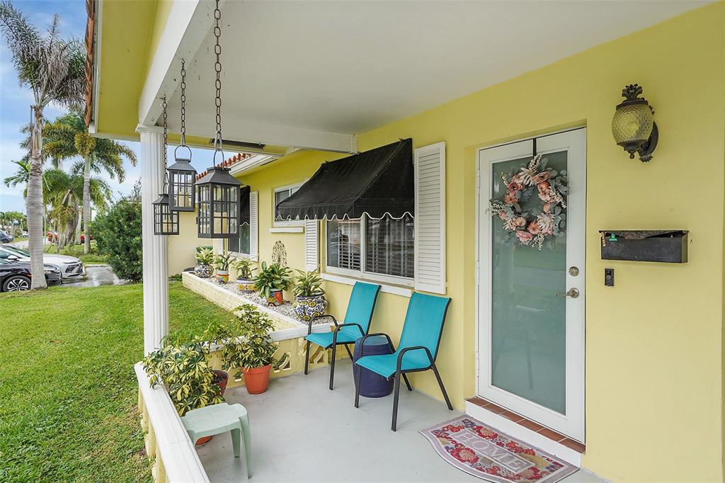 4600 Northwest 45th Street Tamarac, FL 33319 - Photo 3 of 15 a view of a chairs and table in a backyard