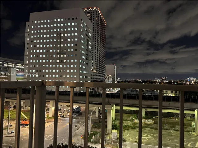 a kitchen with stainless steel appliances kitchen island a refrigerator and a stove top oven