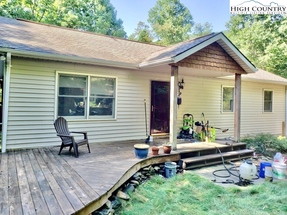 a house view with a sitting space and garden space