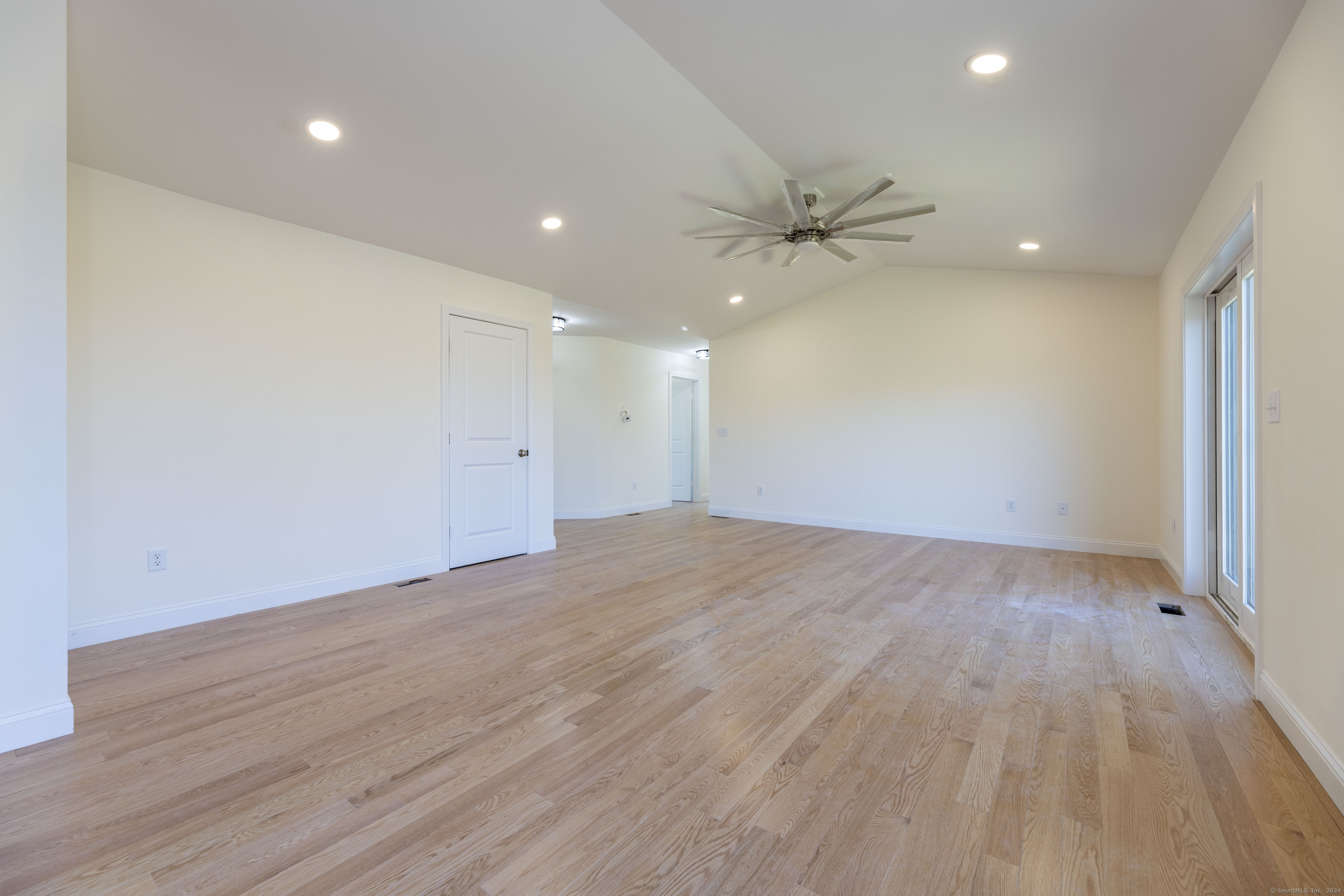 8 John's Circle Sterling, CT 06377 - Photo 11 of 29 an empty room with fan and a ceiling fan