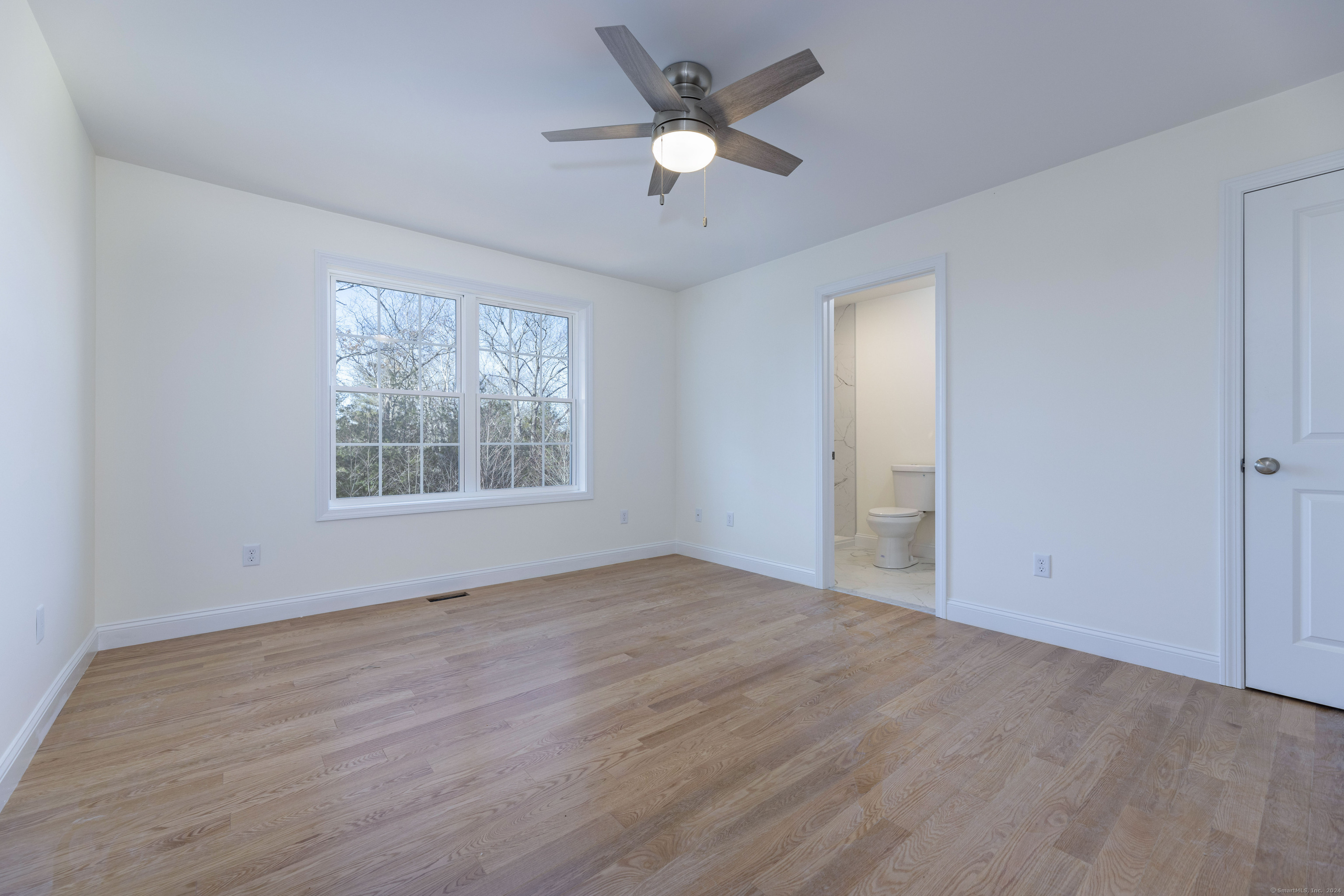 8 John's Circle Sterling, CT 06377 - Photo 14 of 29 an empty room with fan and windows