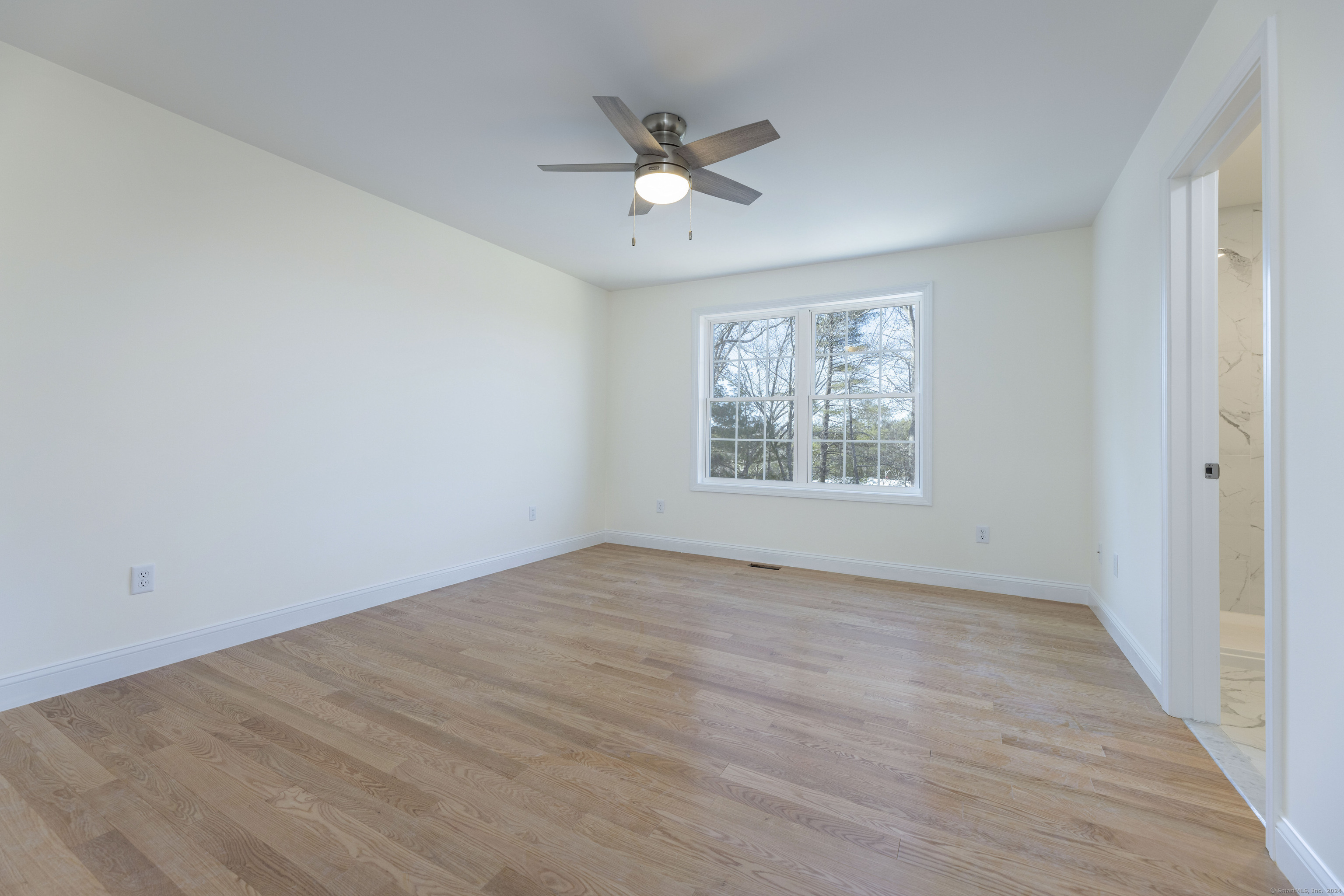 8 John's Circle Sterling, CT 06377 - Photo 15 of 29 wooden floor in an empty room with a window