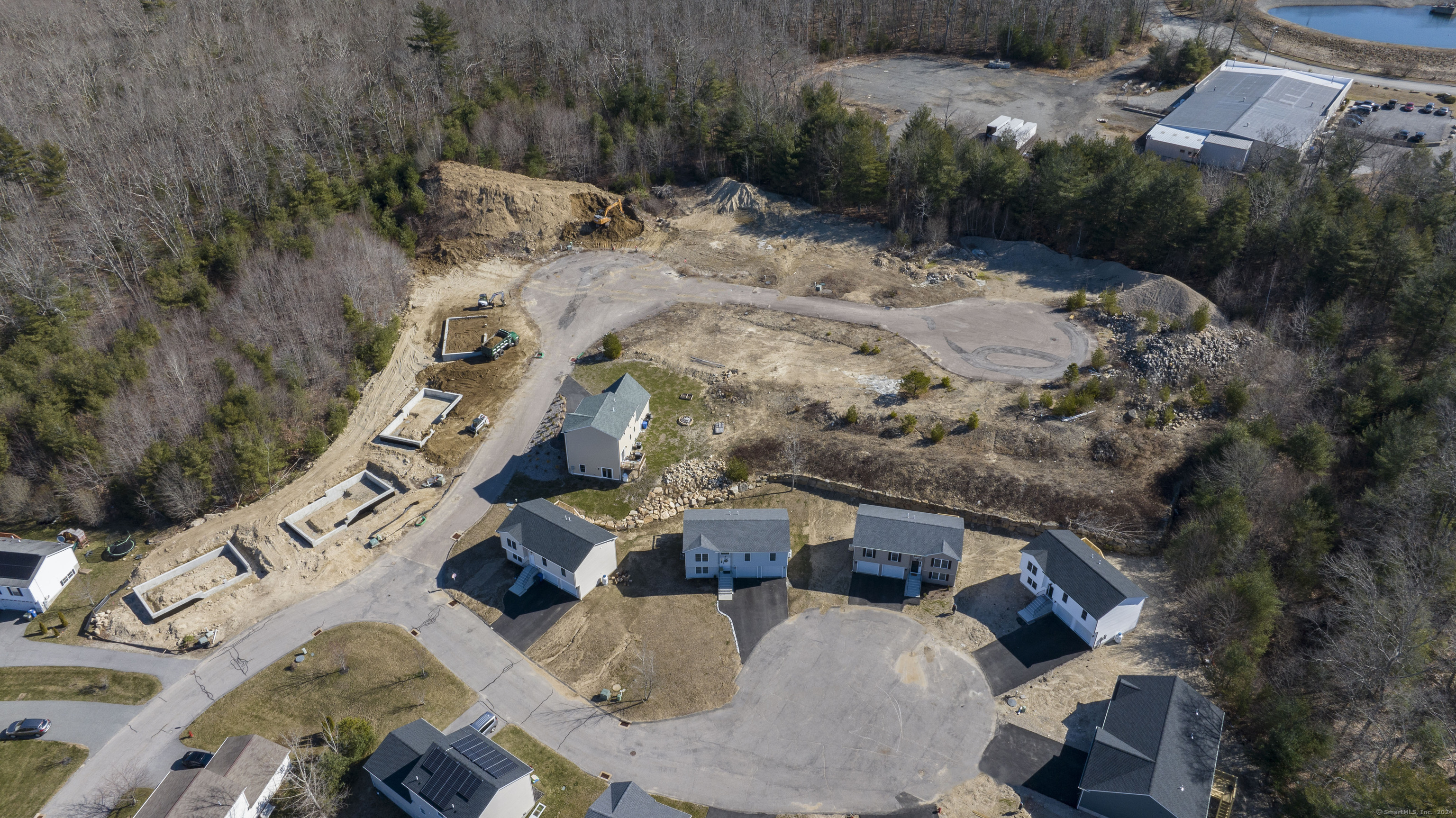8 John's Circle Sterling, CT 06377 - Photo 17 of 29 an aerial view of a house with yard and parking