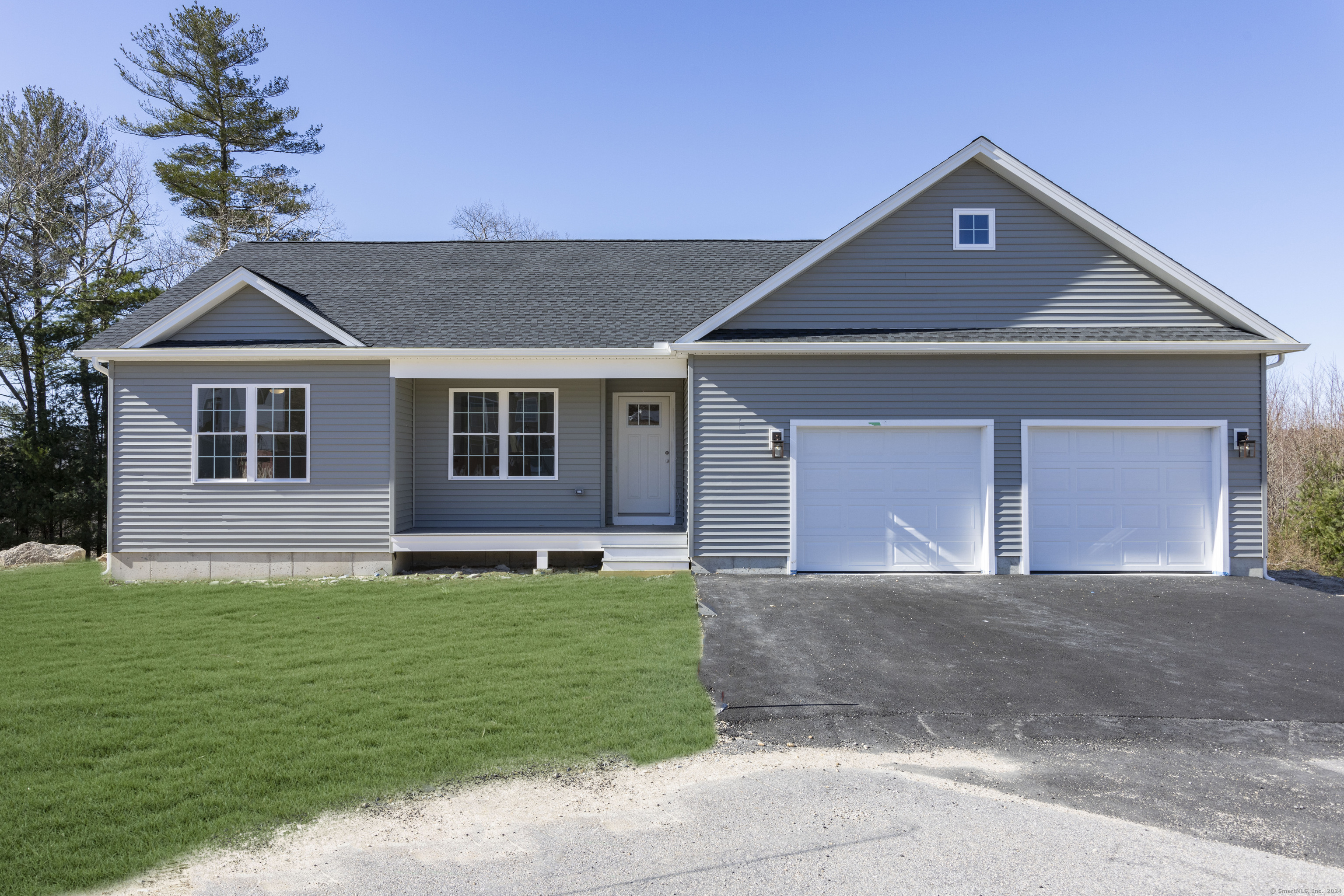 8 John's Circle Sterling, CT 06377 - Photo 23 of 29 a front view of a house with a yard