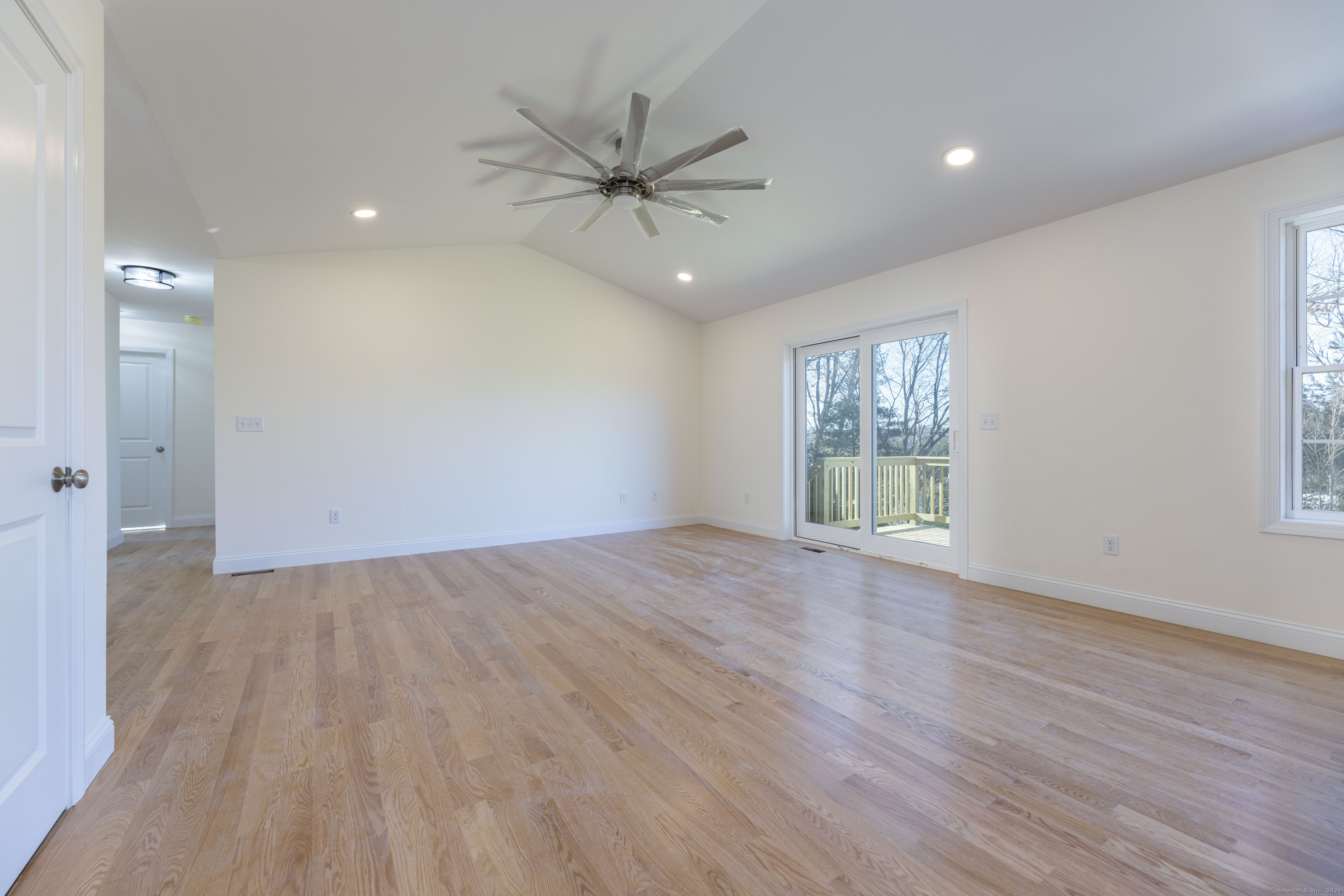 8 John's Circle Sterling, CT 06377 - Photo 26 of 29 a view of an empty room with wooden floor and a window