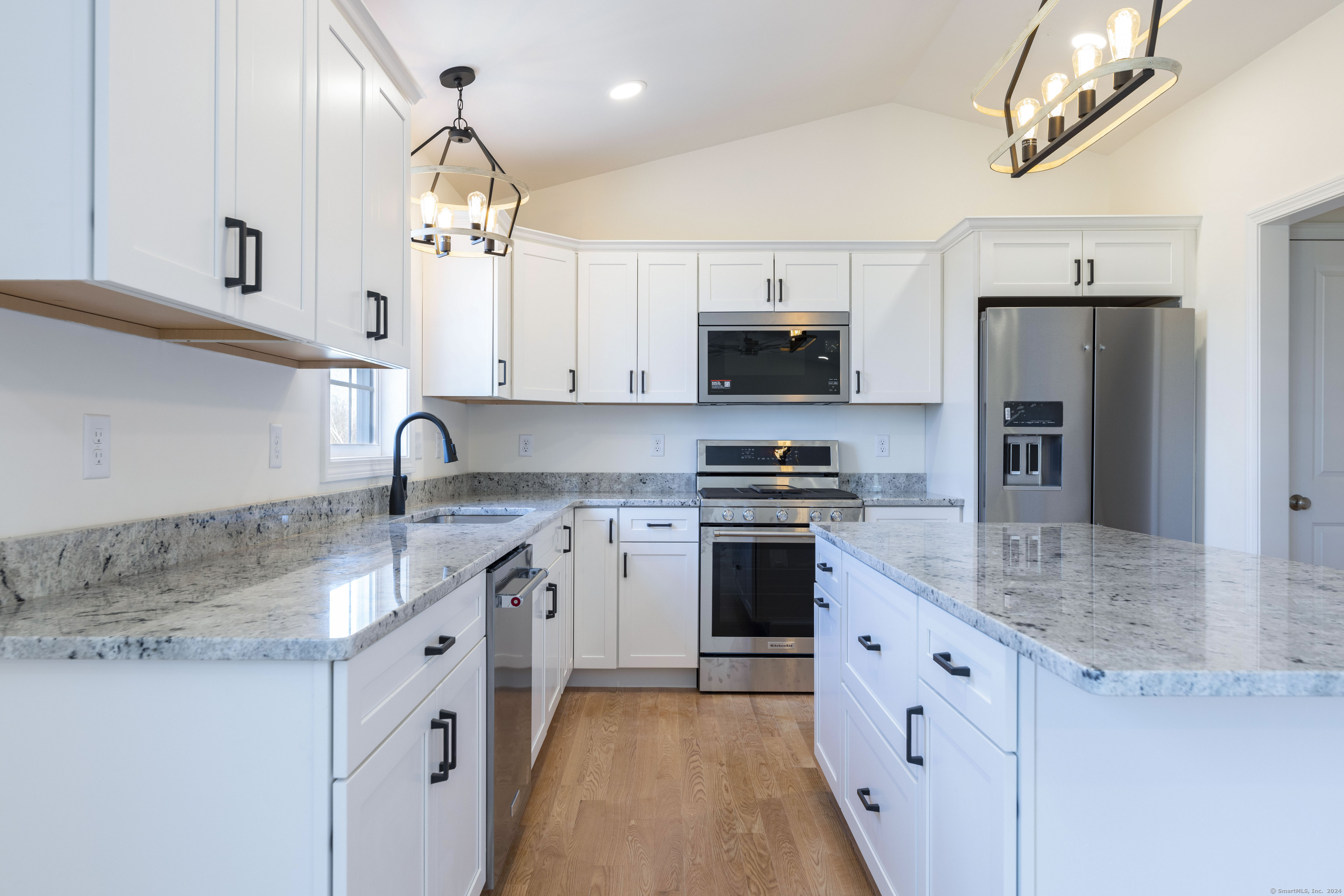 8 John's Circle Sterling, CT 06377 - Photo 4 of 29 a kitchen with stainless steel appliances granite countertop a sink stove and refrigerator