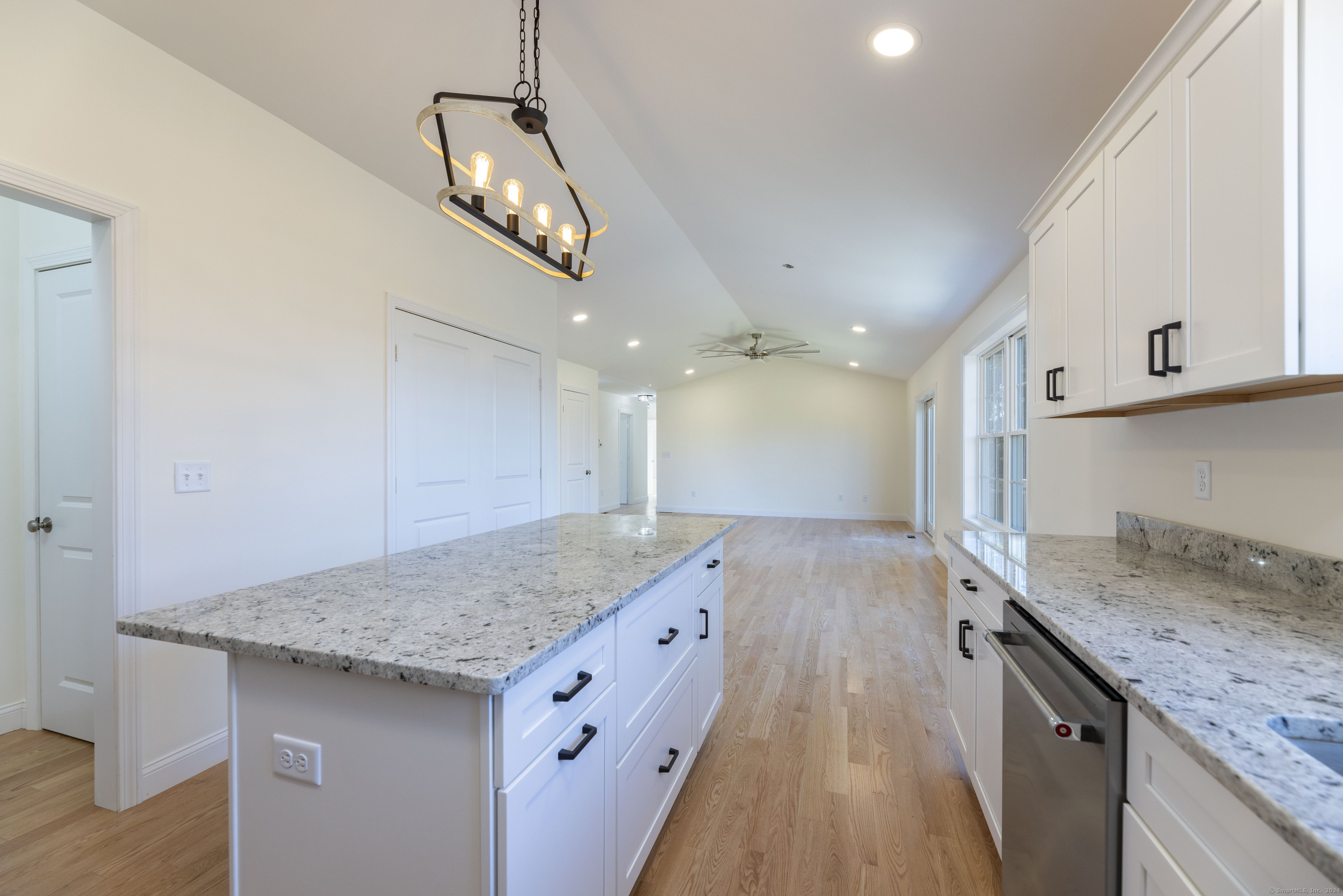 8 John's Circle Sterling, CT 06377 - Photo 5 of 29 a kitchen with a sink a counter space and wooden floor