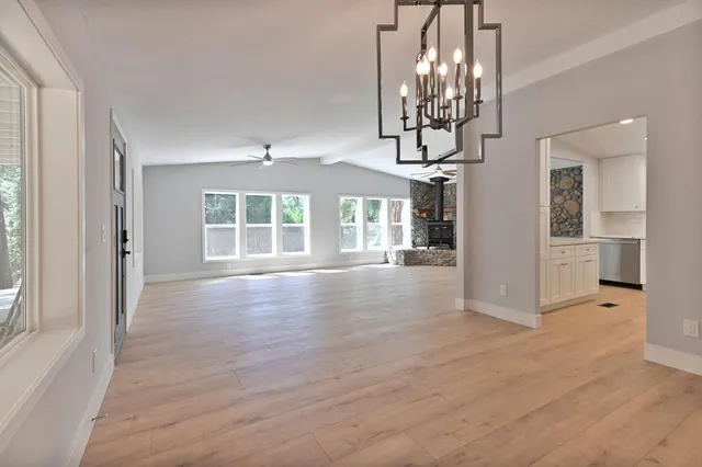 a bathroom with a granite countertop sink a toilet and a bathtub