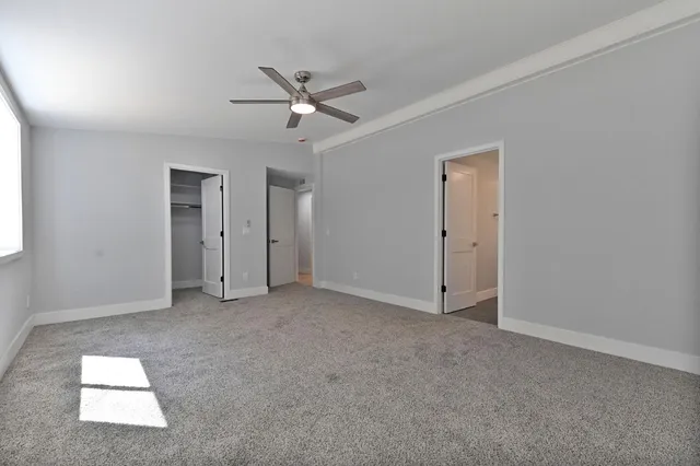 a bathroom with a granite countertop sink double and mirror