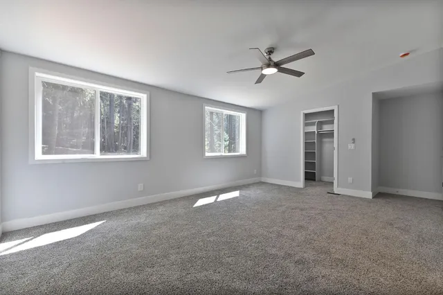 a view of a bathroom with toilet a sink and a window
