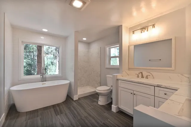 an empty room with closet and a chandelier fan