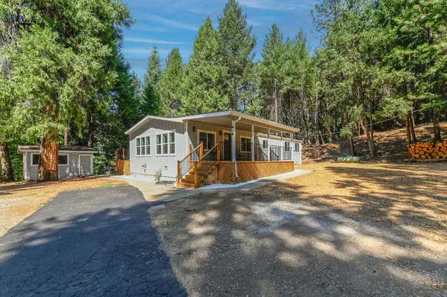 a view of a patio with table and chairs and wooden floor