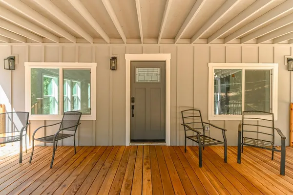 a view of a house with wooden fence
