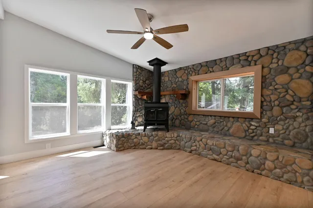 a kitchen with a refrigerator sink and cabinets