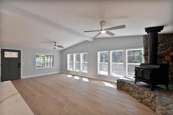 a kitchen with a refrigerator sink and cabinets