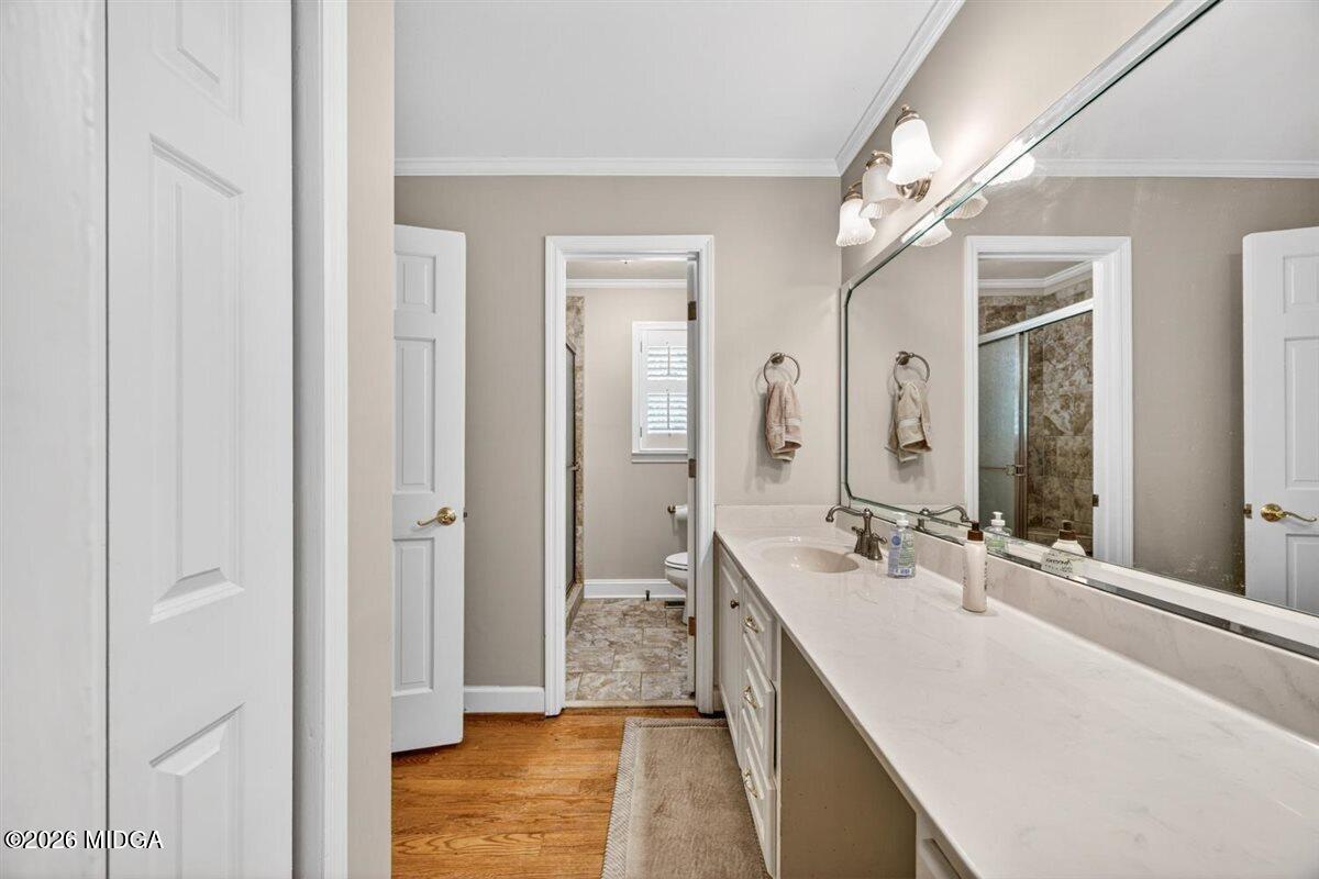 335 Hamrick Road Macon, GA 31220 - Photo 21 of 41 a bathroom with a double vanity sink a mirror and a shower