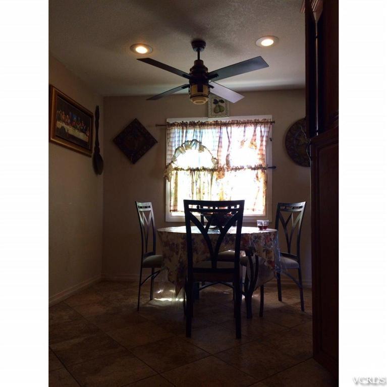 3354 Sycamore Street Oxnard, CA 93033 - Photo 5 of 7 a view of a dining room with furniture window and outside view