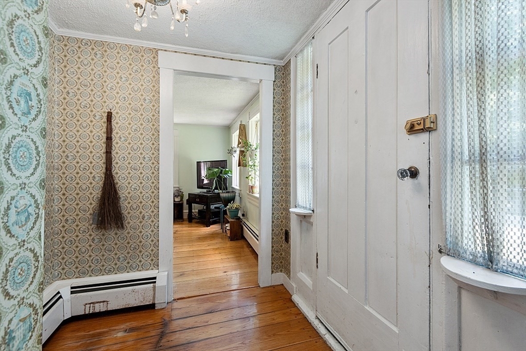 36 West Princeton Road Westminster, MA 01473 - Photo 22 of 42 a view of a hallway with wooden floor and furniture