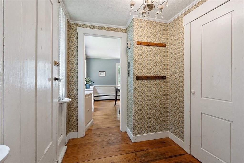 36 West Princeton Road Westminster, MA 01473 - Photo 23 of 42 a view of a hallway with wooden floor and a bathroom