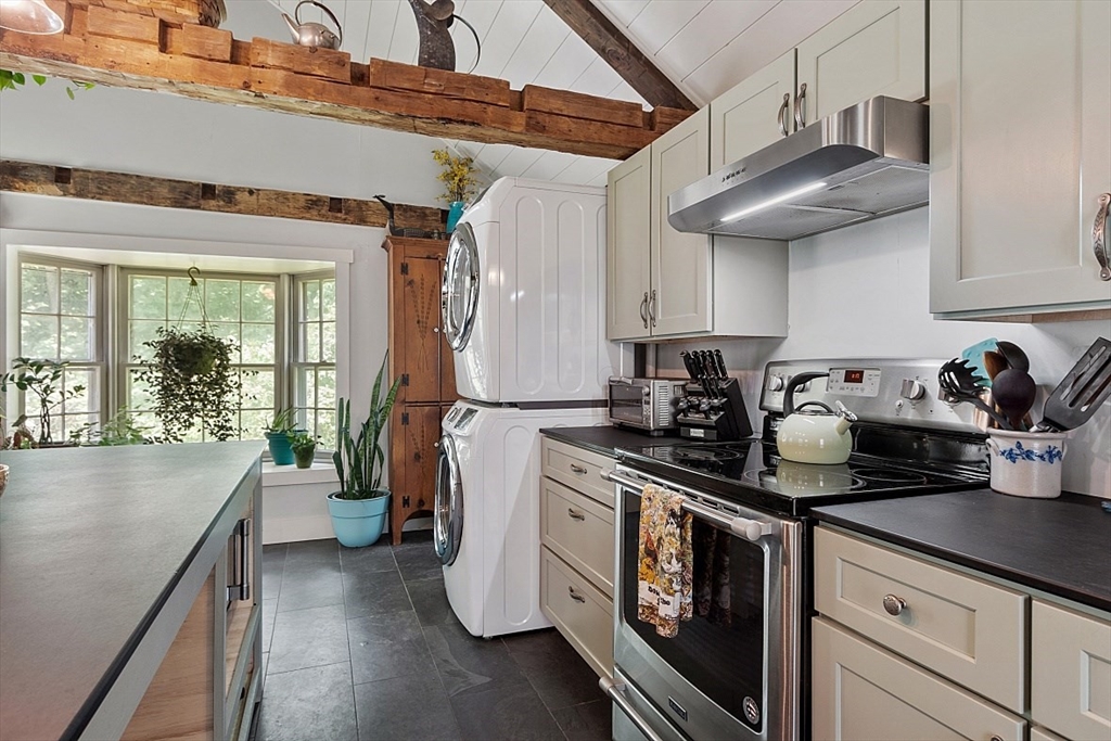 36 West Princeton Road Westminster, MA 01473 - Photo 9 of 42 a kitchen with stainless steel appliances granite countertop a sink a stove and a wooden floors