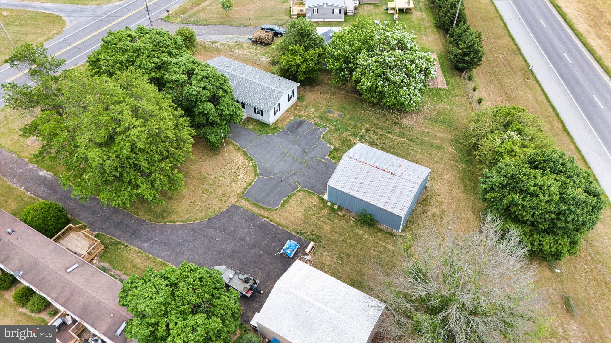 23212 Argos Corner Road Milford, DE 19963 - Photo 26 of 36 an aerial view of a house with garden space and a street view