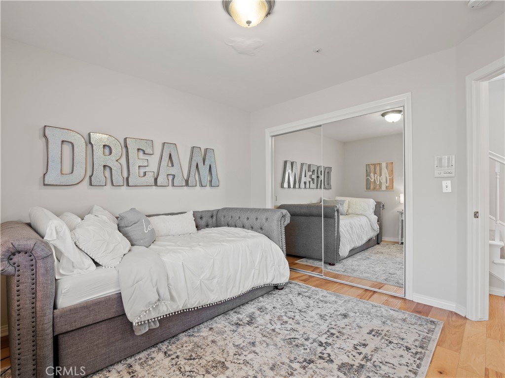 2517 Rockefeller Lane, Unit B Redondo Beach, CA 90278 - Photo 21 of 36 a bedroom with a bed and a couch